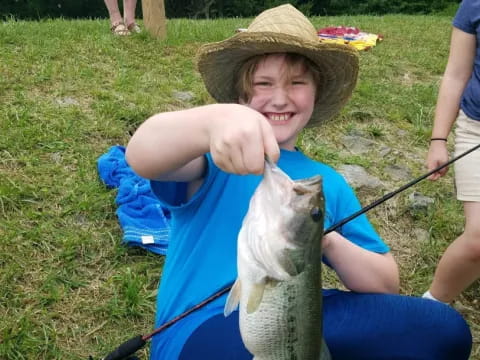a boy holding a rabbit