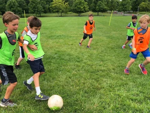 a group of kids playing football