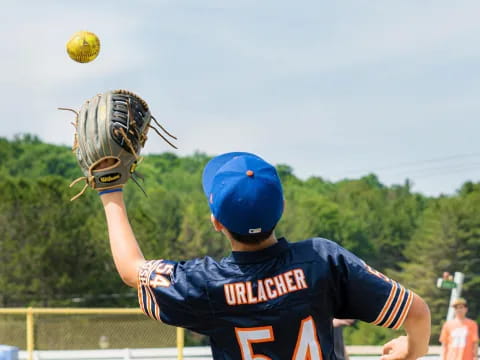 a baseball player catching a ball