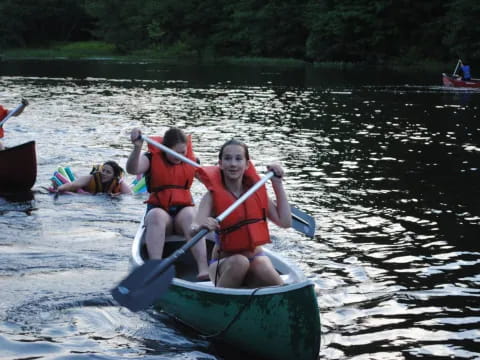 a group of people in a canoe