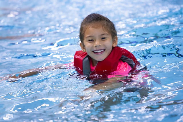 a boy in a pool