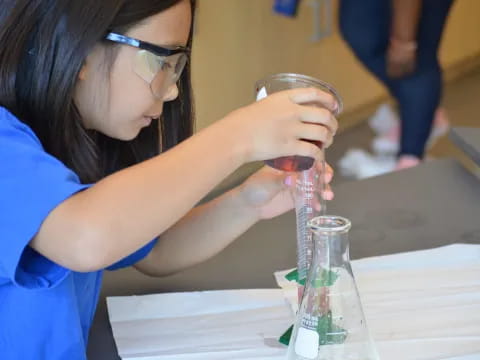 a woman holding a glass