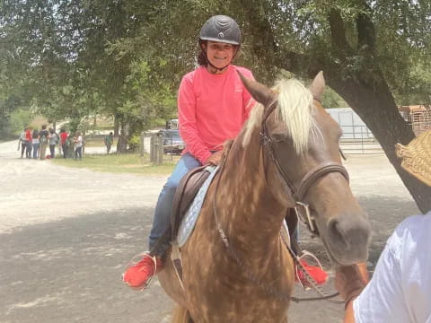 a girl riding a horse