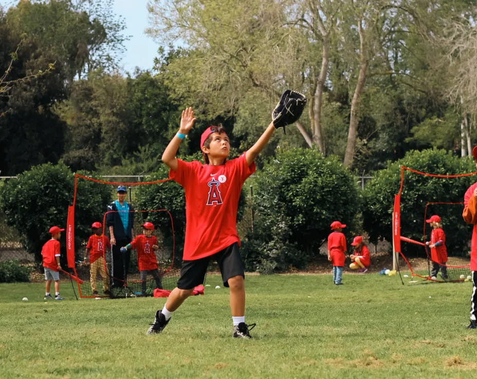 a person catching a baseball