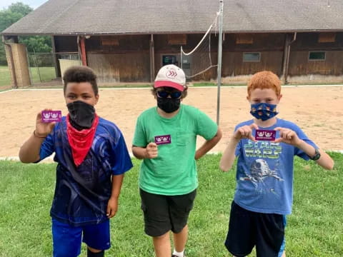 a group of boys wearing masks