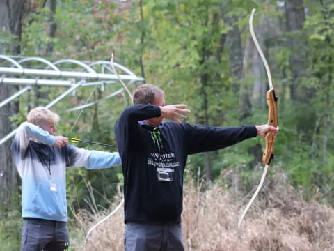 a man holding a bow and arrow