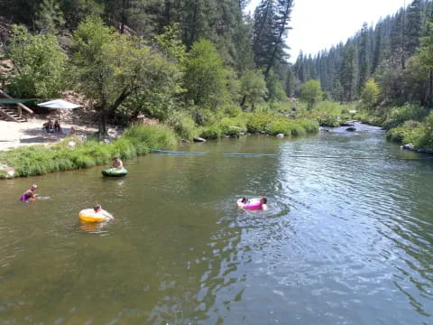 a group of people in a river