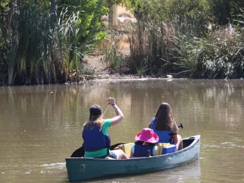 a group of people in a canoe