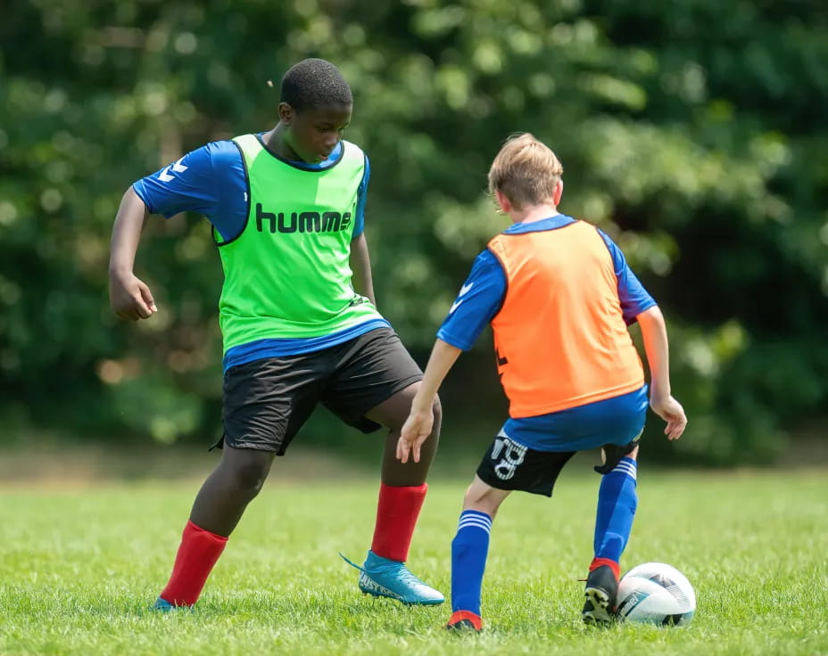 a couple of boys playing football