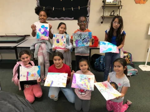 a group of children holding books