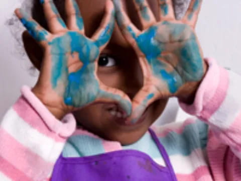 a girl with her hands on her face