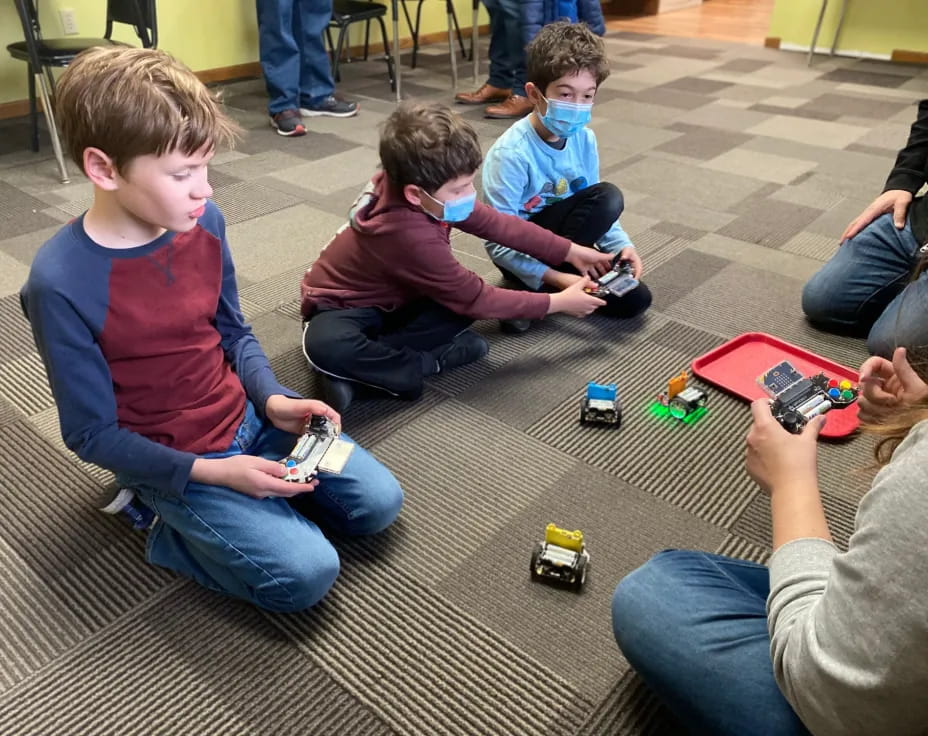 a group of kids playing with toys
