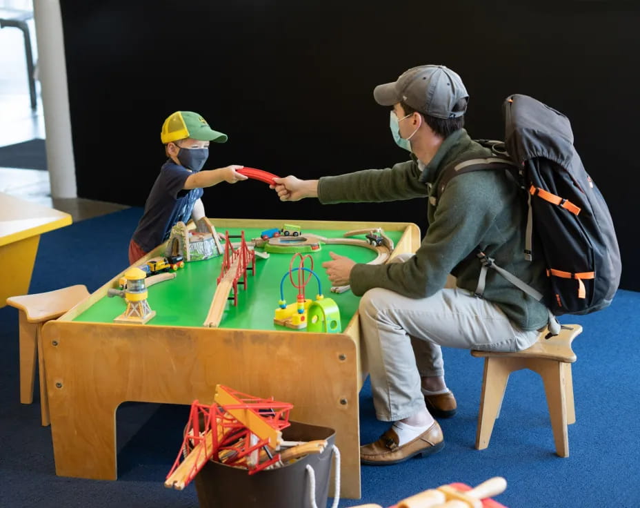 a person and a boy painting