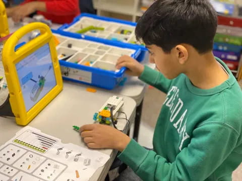 a young boy playing with a toy