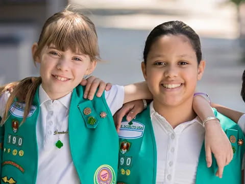 a group of girls holding books