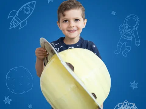 a boy holding a fish