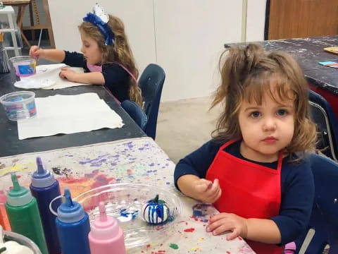 a girl sitting at a table