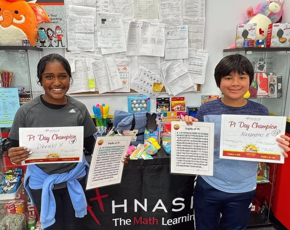 a couple of girls holding signs