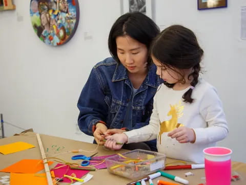 a couple of women painting
