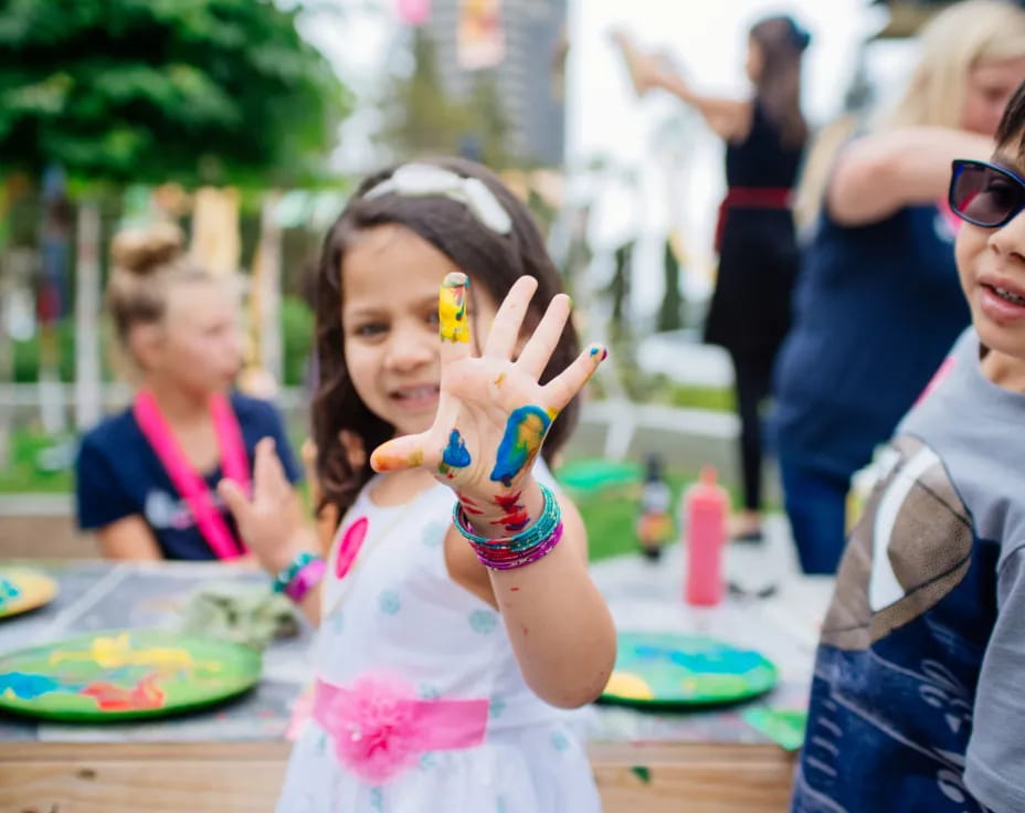 a girl holding a toothbrush
