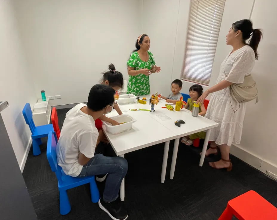 a group of people around a table