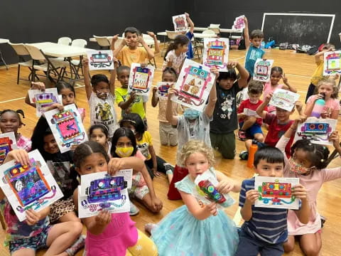 a group of children holding books