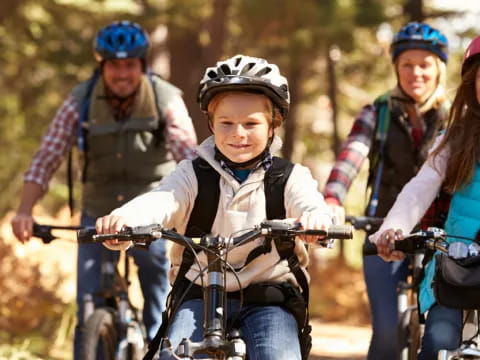 a group of people riding bikes