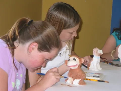 a person and a child painting