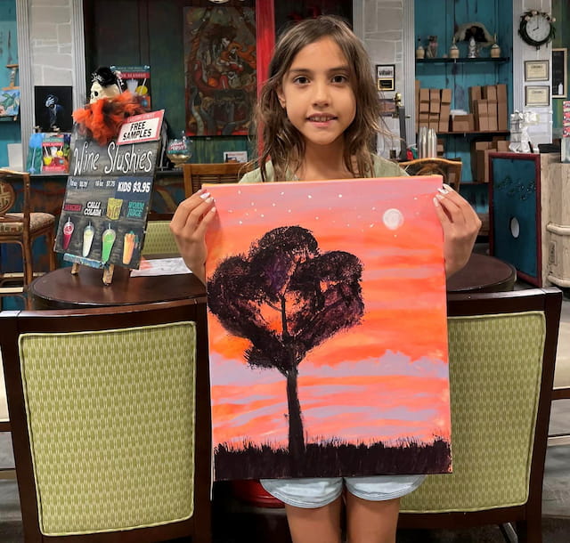 a girl holding a book