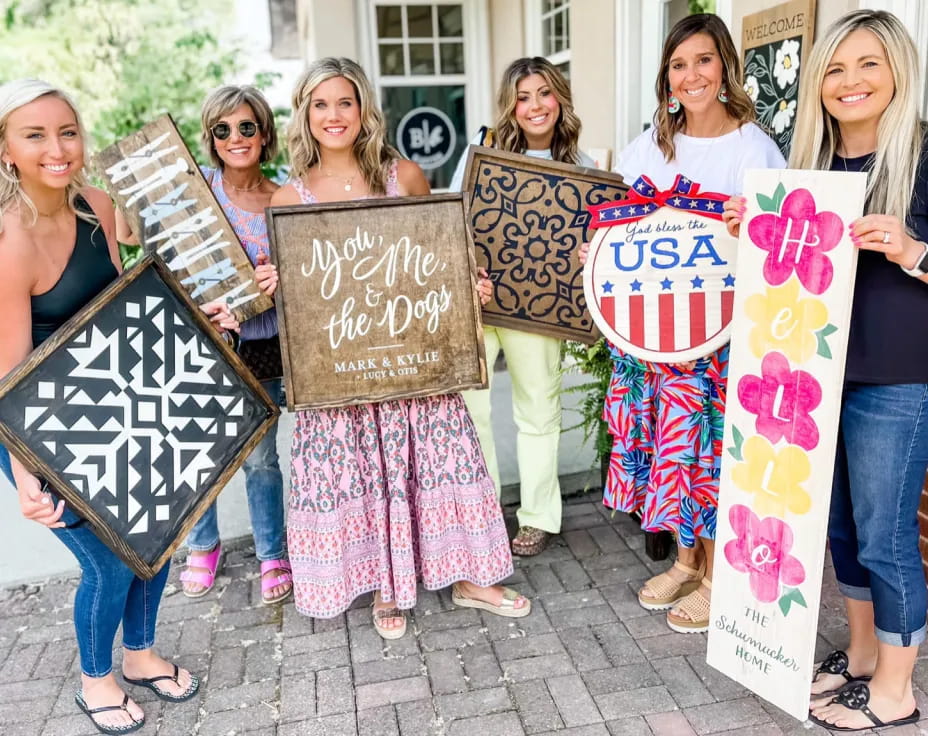 a group of women holding signs