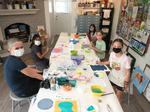 a group of people painting