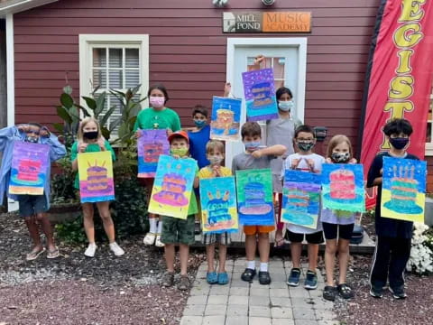 a group of children wearing masks