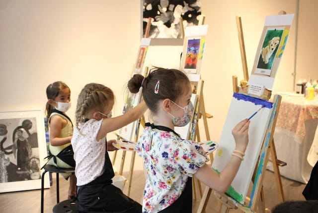 a group of children painting