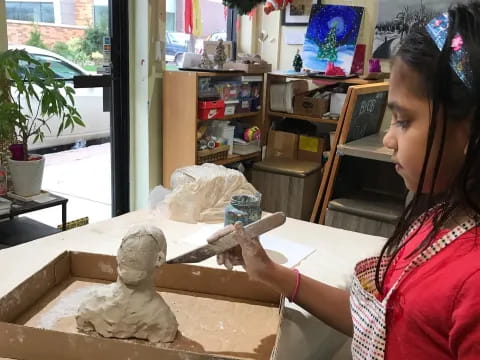 a person painting a statue