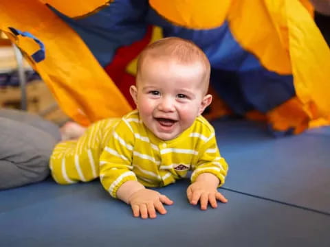 a baby crawling on the floor