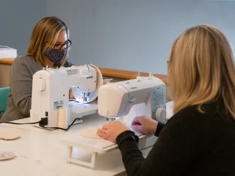 a person looking at a microscope