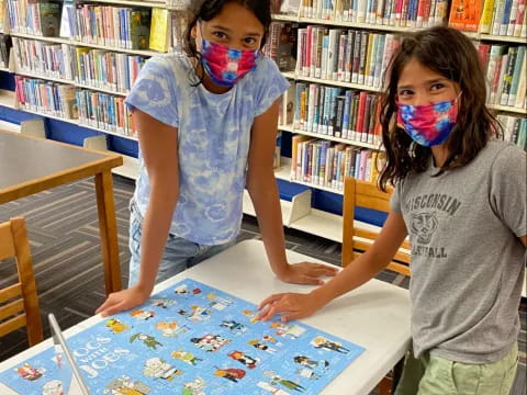 a couple of kids with face paint