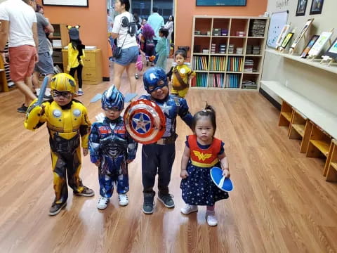 a group of kids wearing clothing