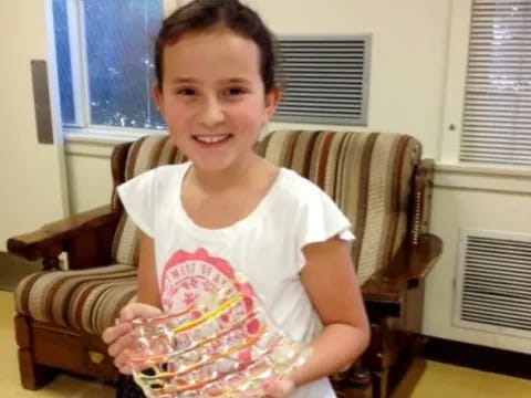 a girl sitting in a chair