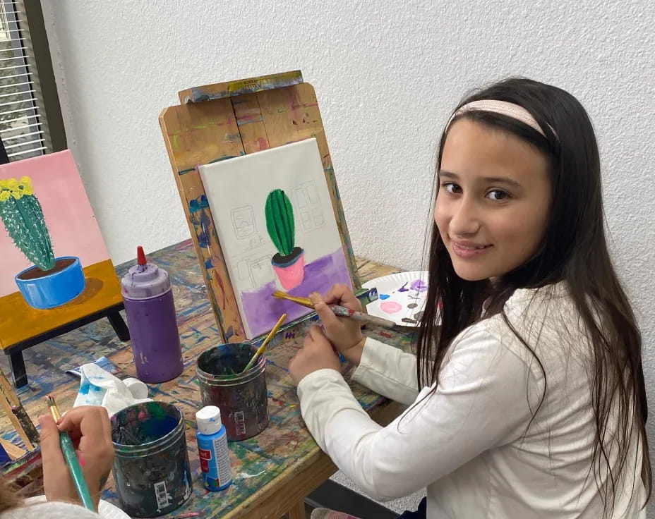 a person painting on a table