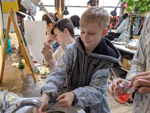 a few young boys painting