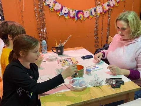 a group of people painting