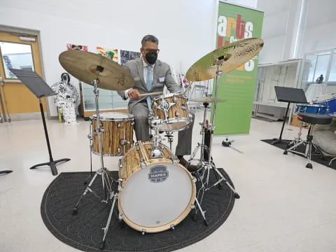 a man playing a drum set