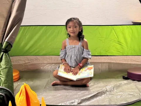 a girl holding a cake