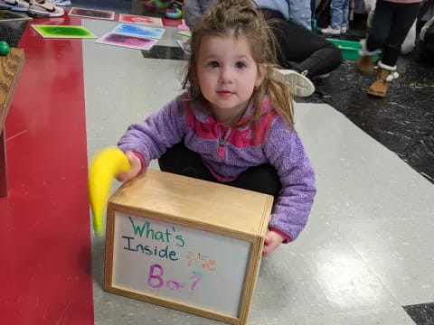 a girl sitting on the floor