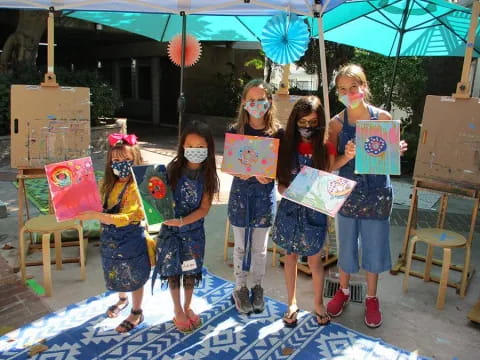 a group of children holding signs