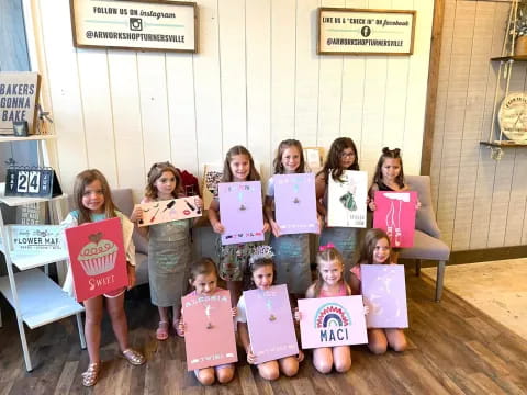 a group of children holding signs