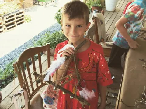 a boy holding a toy sword