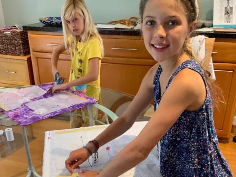 a girl painting with a brush