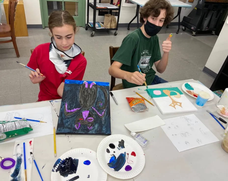 a couple of kids painting